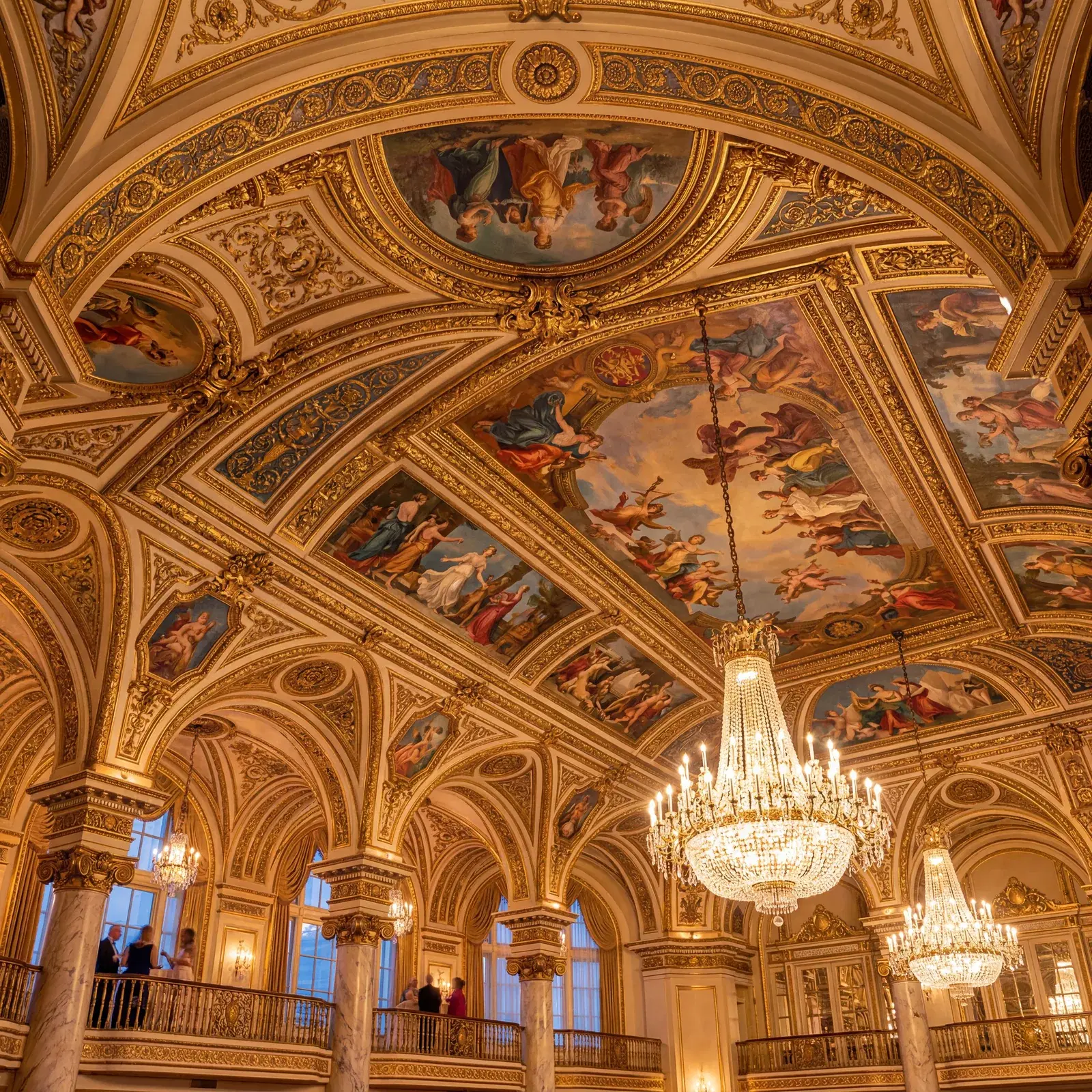 Ornate Beaux-Arts ballroom ceiling in the Palmer House Chicago covered in French frescoes and gilded architectural details, warm editorial travel photography, golden hour, photorealistic, no text, no watermark, 16:9