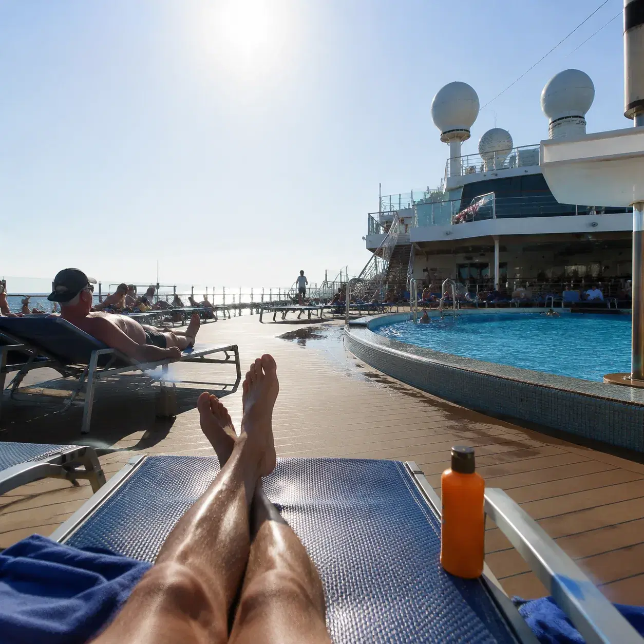 Realistic editorial photo of cruise passenger reviewing package offers on a phone beside a pool deck towel and drink men