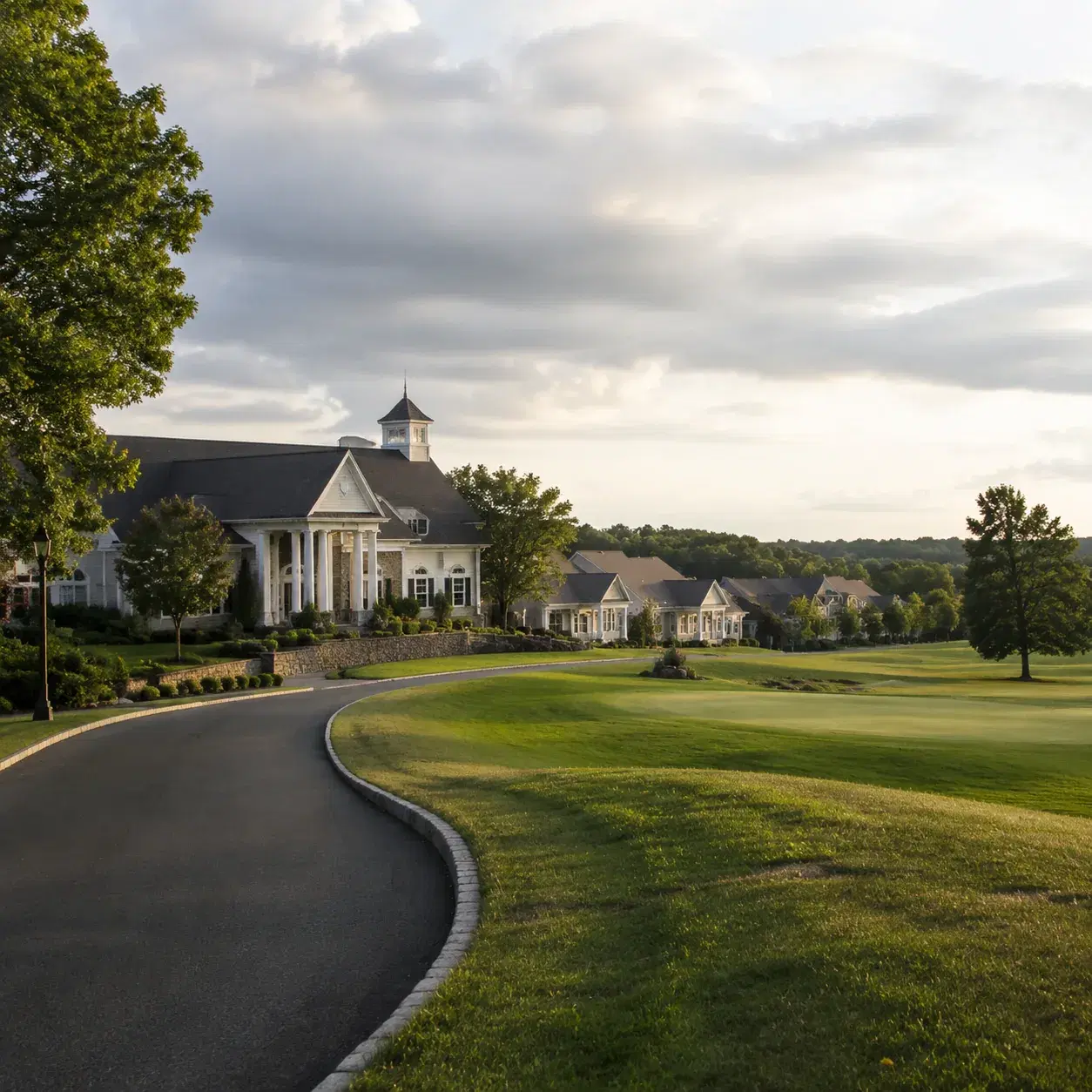 Realistic editorial photo of a Jackson New Jersey active adult country club community with fairway homes, clubhouse road