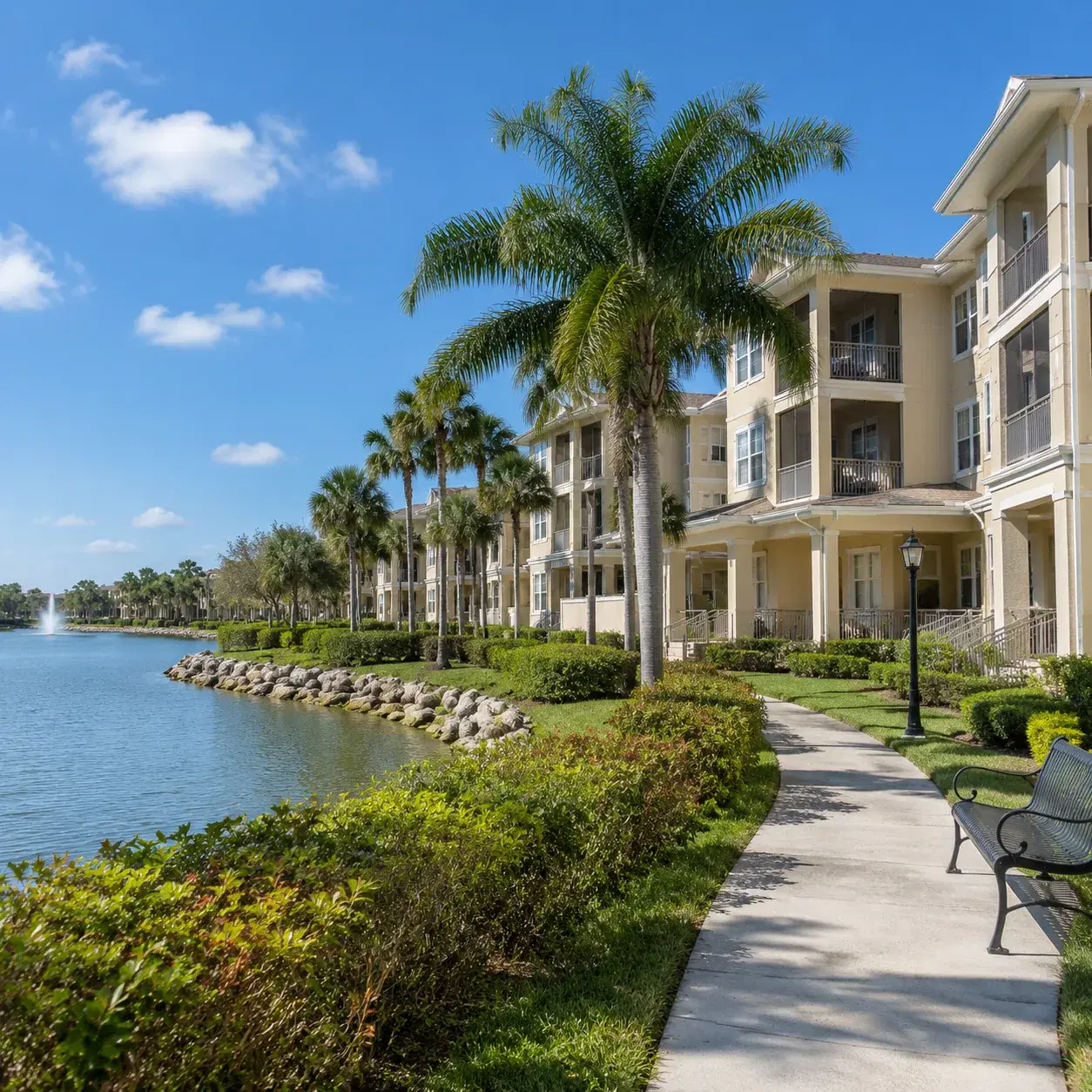 Realistic editorial photo of a large Florida continuing care retirement campus near water with senior apartment building
