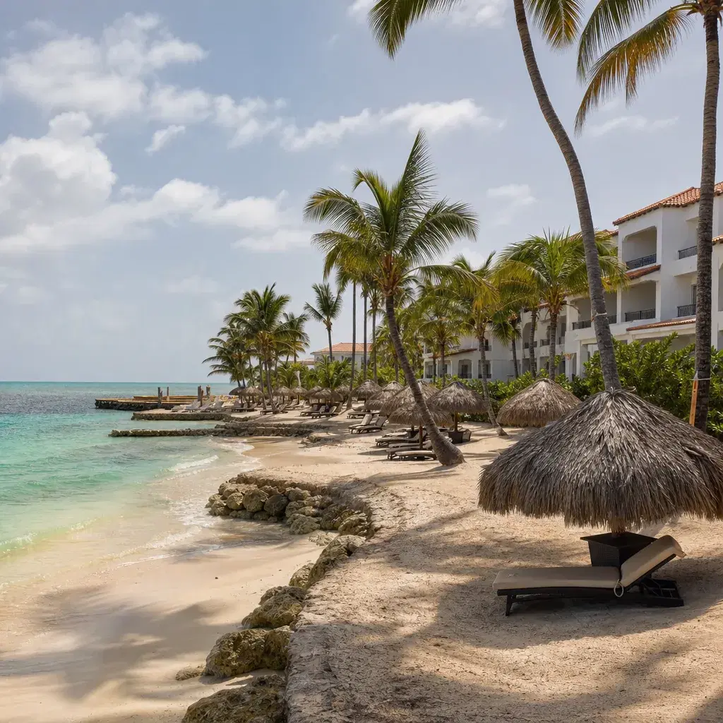 Realistic editorial photo of Punta Cana all-inclusive resort scene showing resort with a tiny real beachfront, palms and