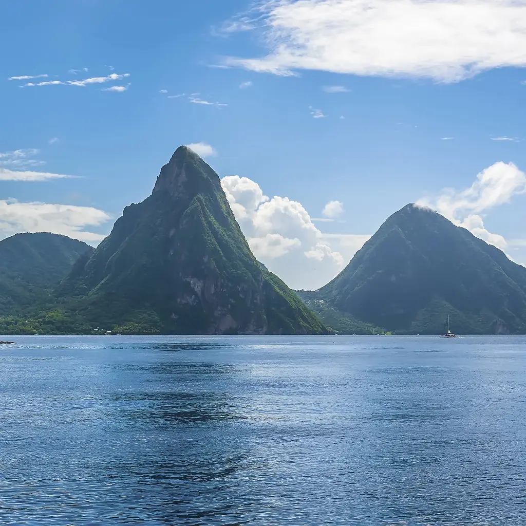 The Pitons rising behind Soufriere Bay in St. Lucia