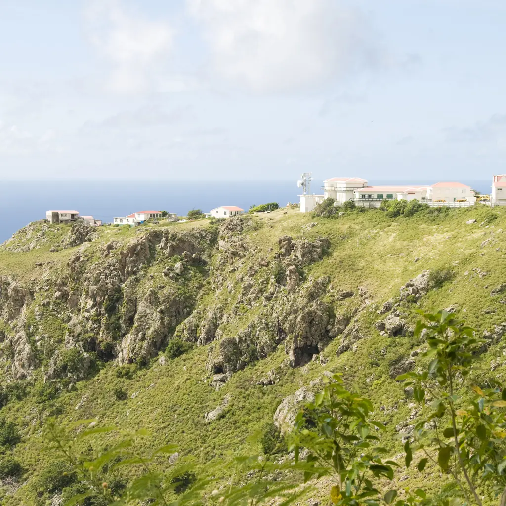 Houses on the steep cliffs of Saba above the Caribbean Sea
