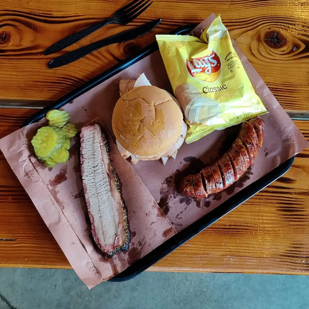 Evie Mae's Pit Barbeque barbecue food, photo credited to @smokedfoodaddict on Instagram.