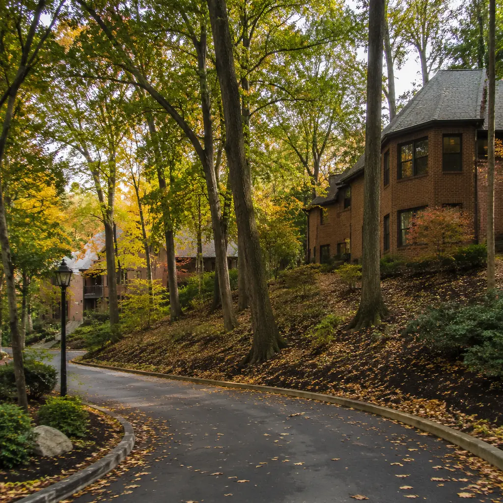Realistic editorial photo of a wooded Pennsylvania retirement community with brick buildings tucked among tall trees on