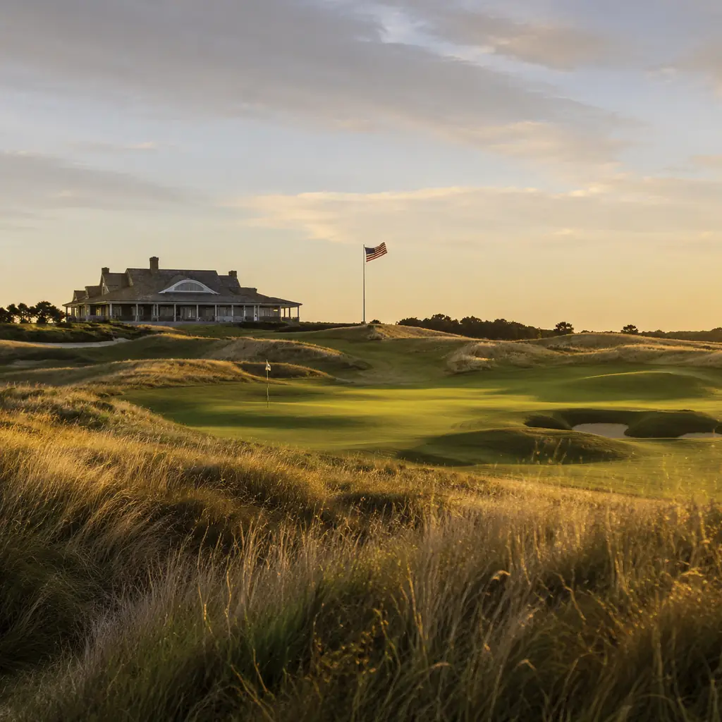 Realistic editorial photo of a Long Island links style private golf course with rolling fescue, low clubhouse silhouette