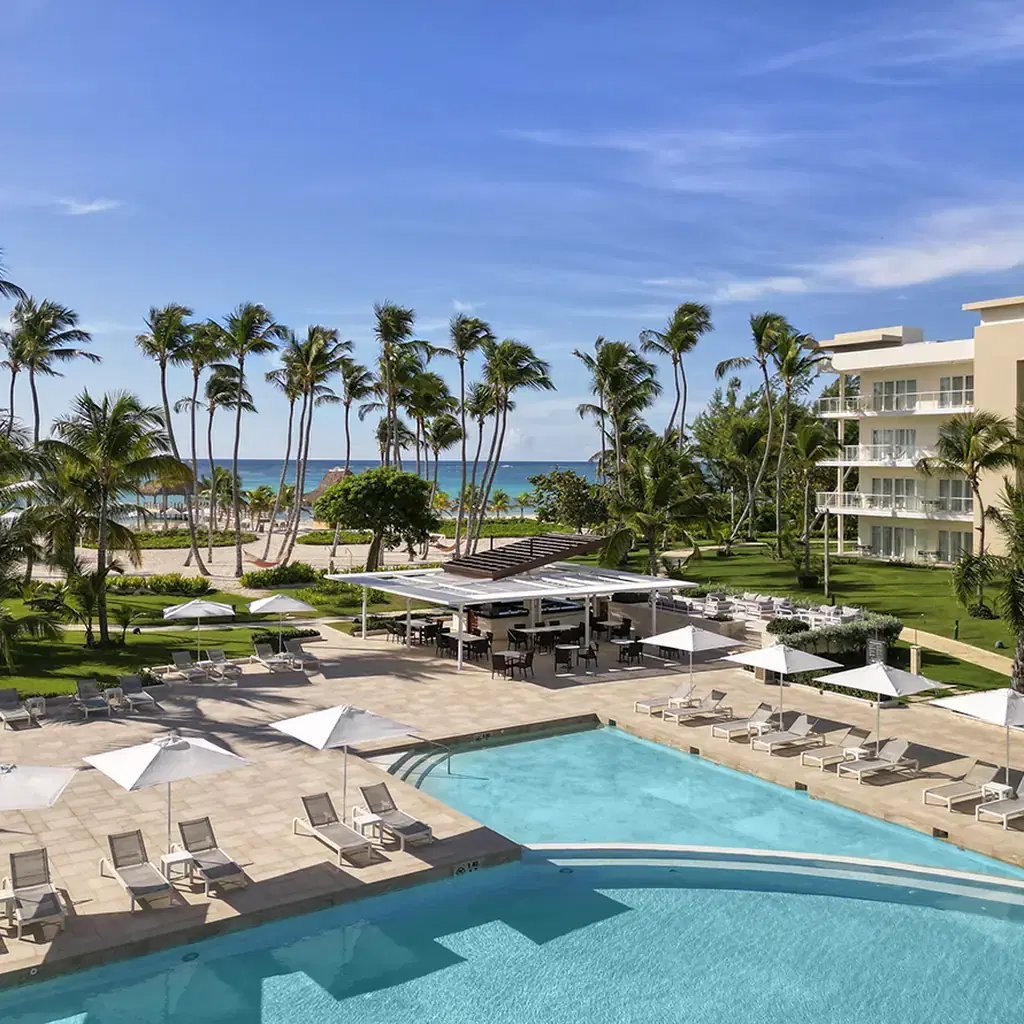 Pool, palm trees, and hotel buildings at Puntacana Resort and Club