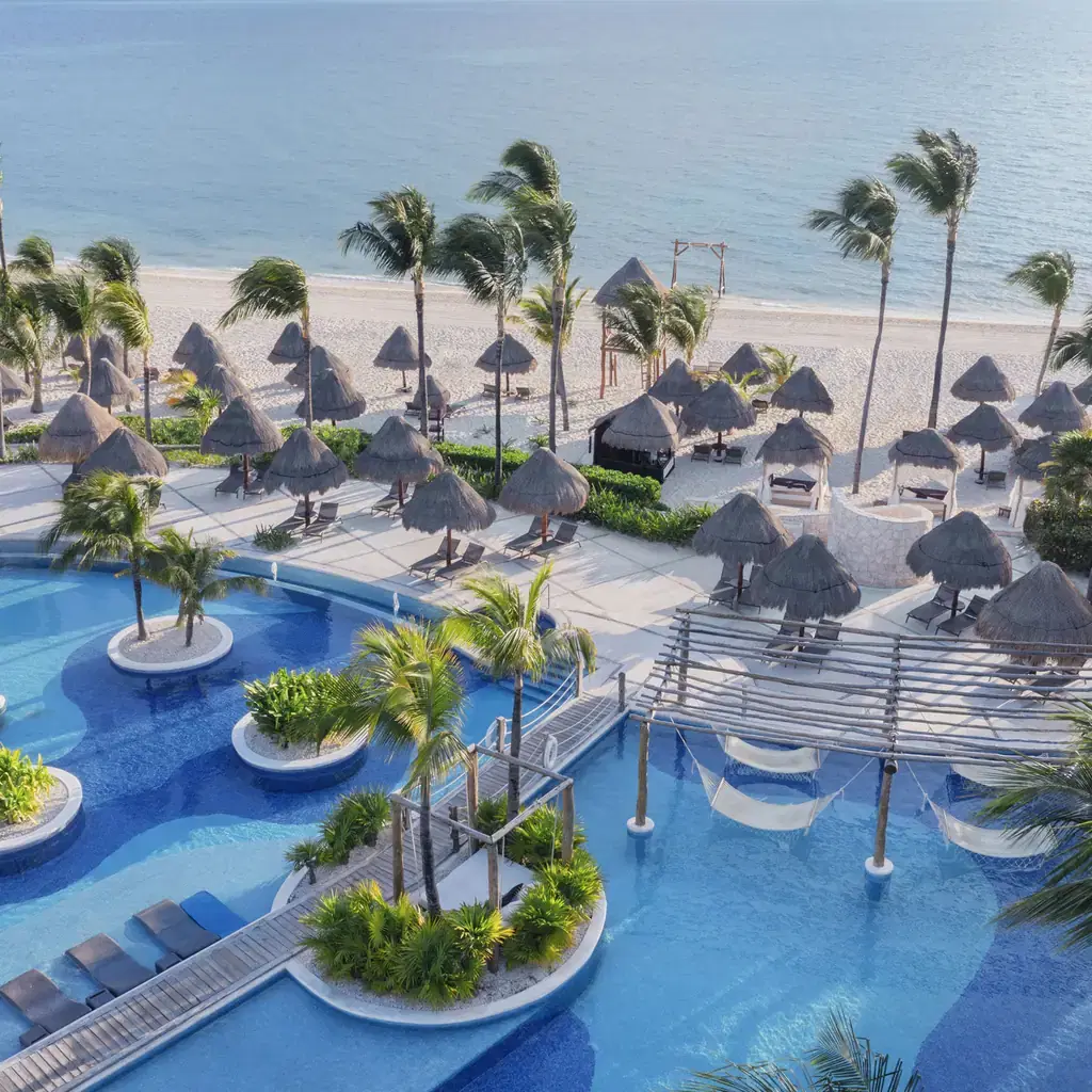 The main pool and beachfront at Excellence Playa Mujeres
