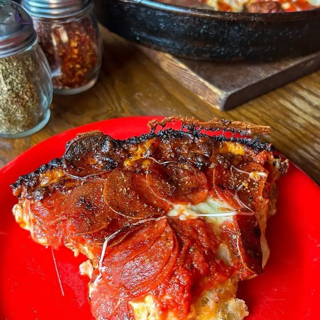 Pequod's Pizza, photo credited to @midwestfoodiegirl on Instagram.
