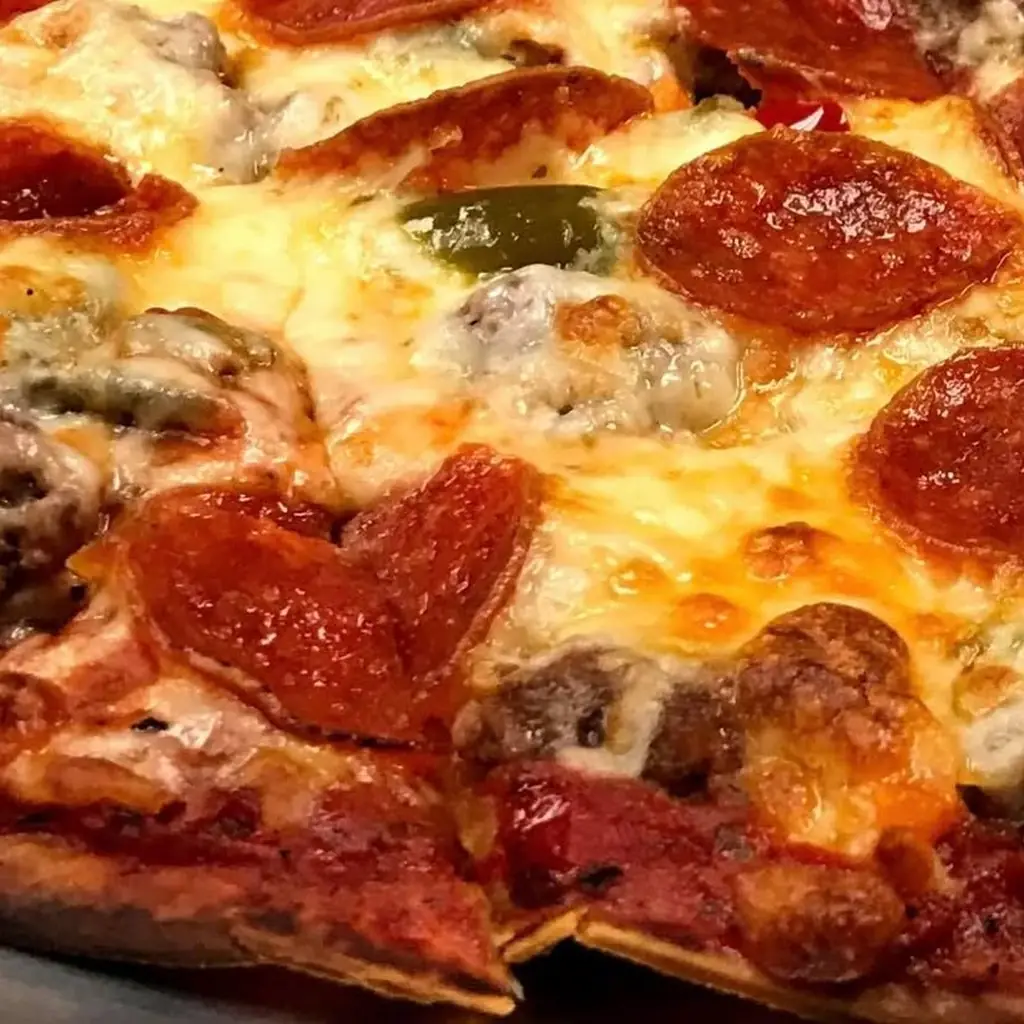 Pat's Pizza & Ristorante, photo credited to @patspizzachicago on Instagram.