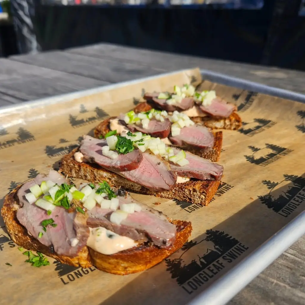 Longleaf Swine, Raleigh, photo credited to @bridgesatnorthhills on Instagram.