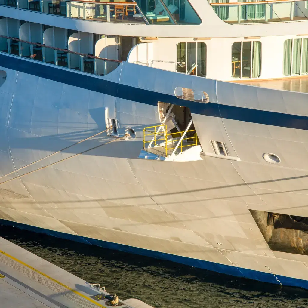 Boarding doorway on the side of a cruise ship docked at a quay