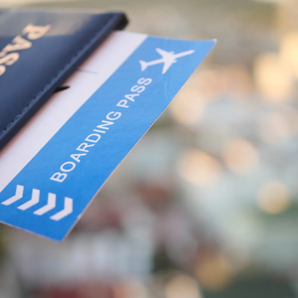 A passport and boarding pass ready for an international flight