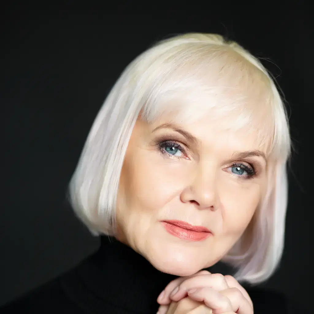 A woman with a light bob and a soft side-swept fringe