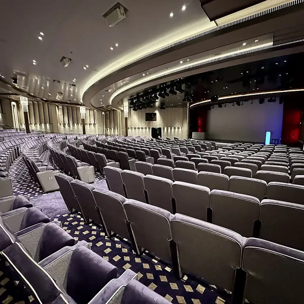 Rows of seats and the stage in Queen Anne’s Royal Court Theatre