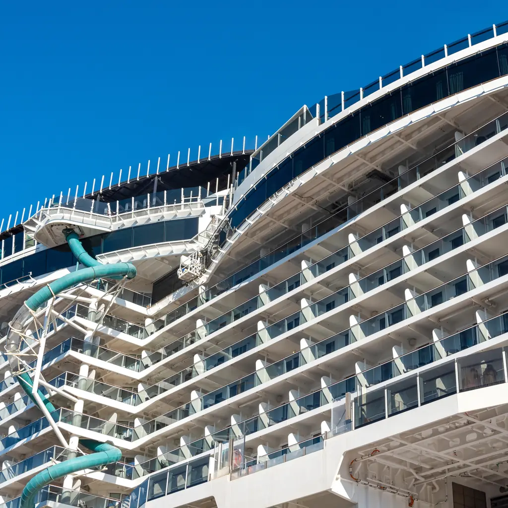 Cruise ship balconies and an upper-deck waterslide