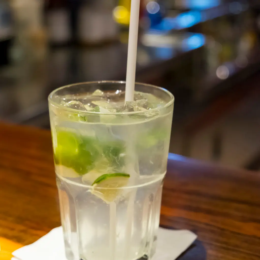 A lime and mint cocktail on a cruise ship bar counter