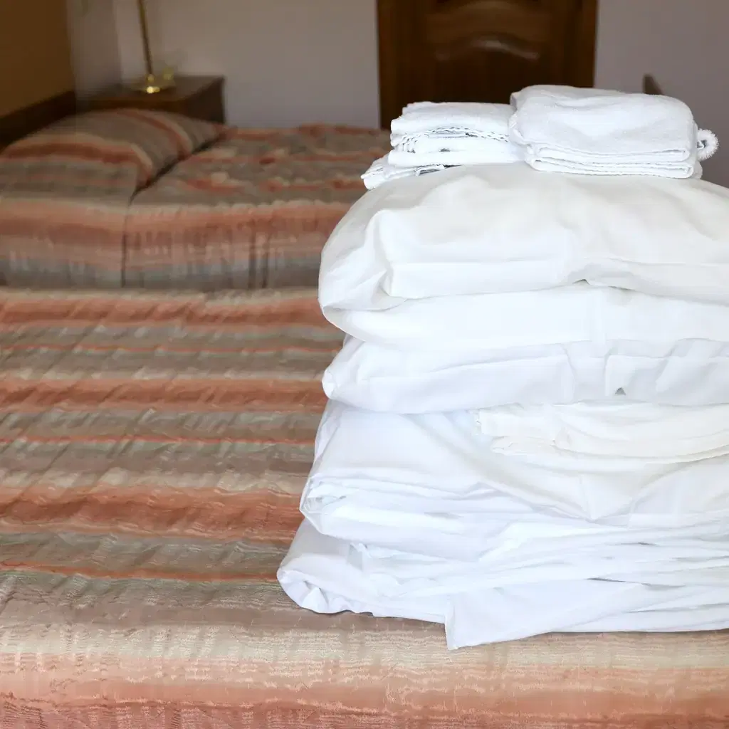 Fresh towels folded on a bed