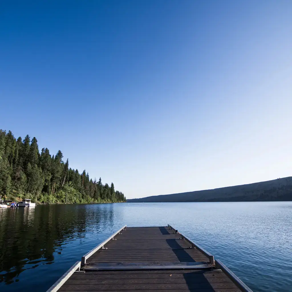 A wooden dock extends into Wallowa Lake in Oregon.