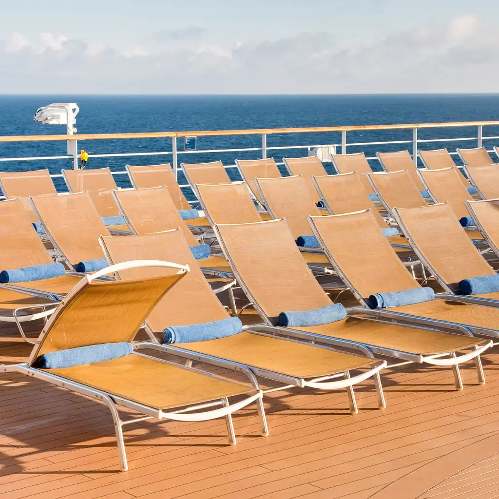 Sun loungers on an outdoor cruise-ship deck