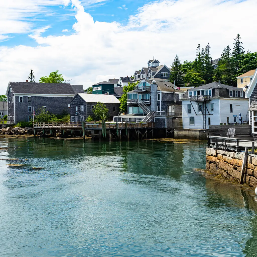 Buildings beside the working harbor in Stonington, Maine.