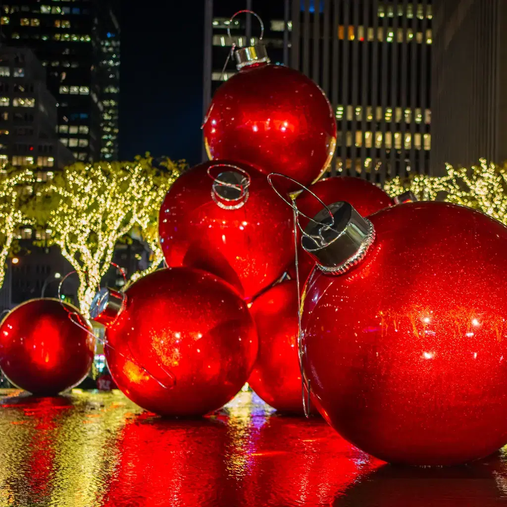 Pedestrians in winter coats on Fifth Avenue in New York during the December holidays