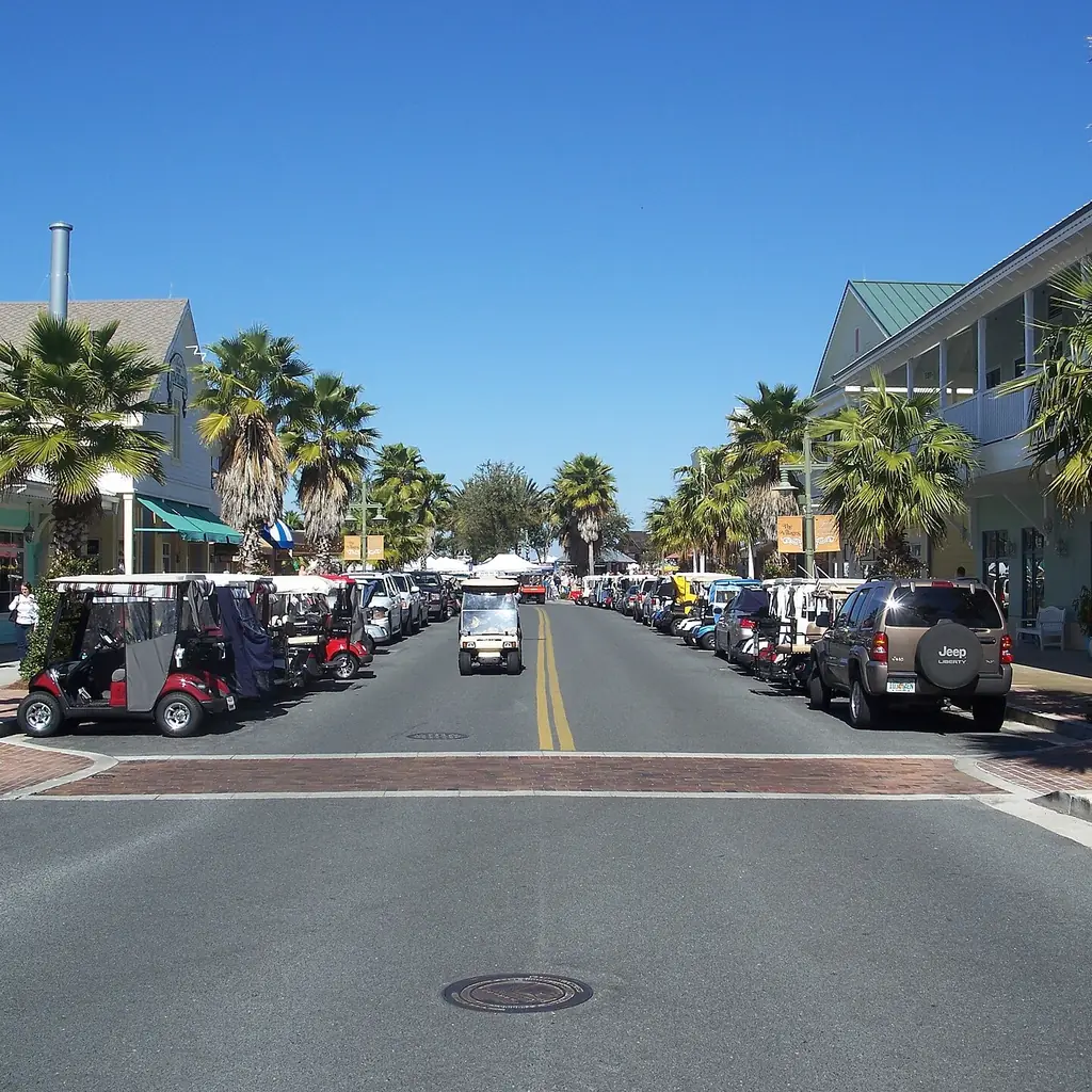 Golf carts parked along a town square street in The Villages, Florida