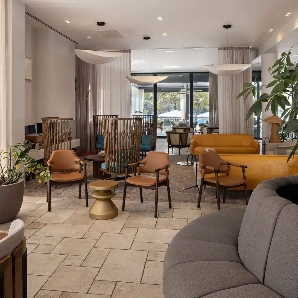 A spacious resort concierge-style lounge with modern seating, illustrating what Club Level lounge access includes.