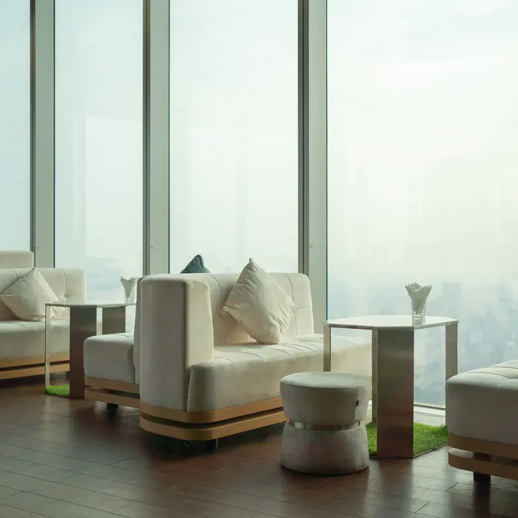 A hotel sky bar lounge terrace with city views, illustrating lounge access as a property feature rather than a guaranteed brand perk.