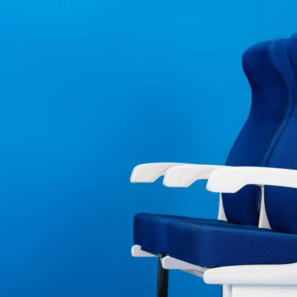 A single airplane seat shown isolated, illustrating how airlines are now splitting basic tiers inside premium cabins too.