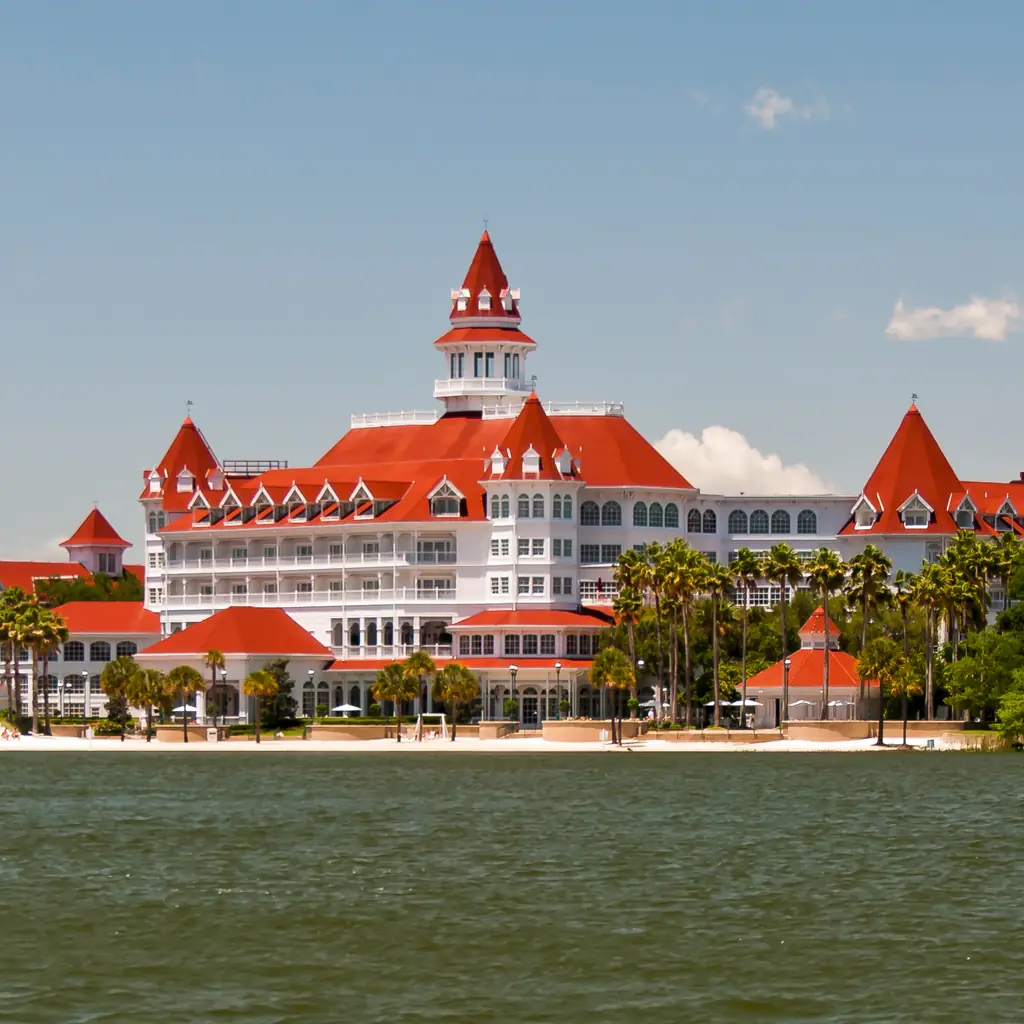 Disney's Grand Floridian Resort and Spa seen from across Seven Seas Lagoon, a Deluxe resort category example.