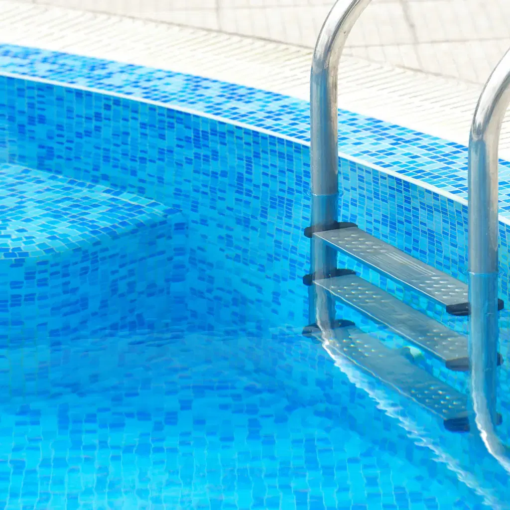 A close-up of swimming pool steps, illustrating what direct swim-up access actually means at a resort.