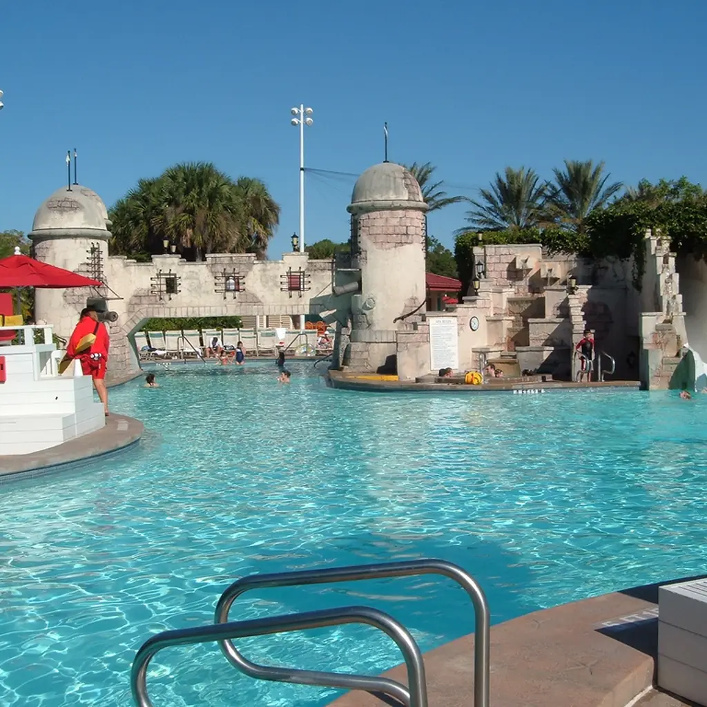 The fortress-themed feature pool at Disney's Caribbean Beach Resort, illustrating pool complexity differences between resorts.